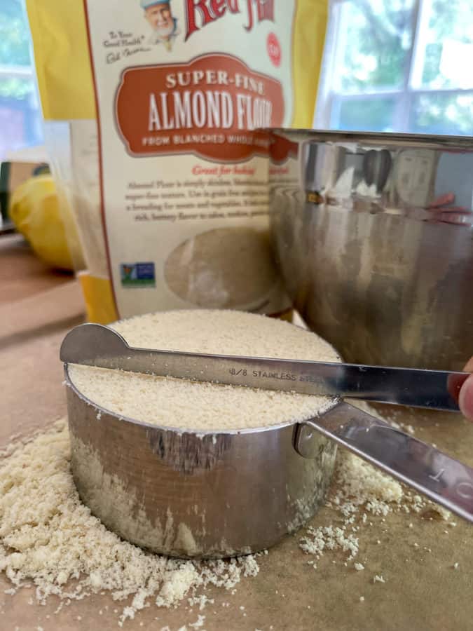 Leveling flour in measuring cup