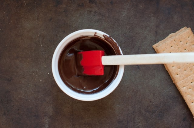 semi melted chocolate in a bowl with spatula