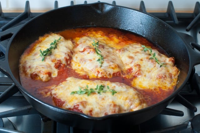 Skillet chicken parm in a skillet on the stove.