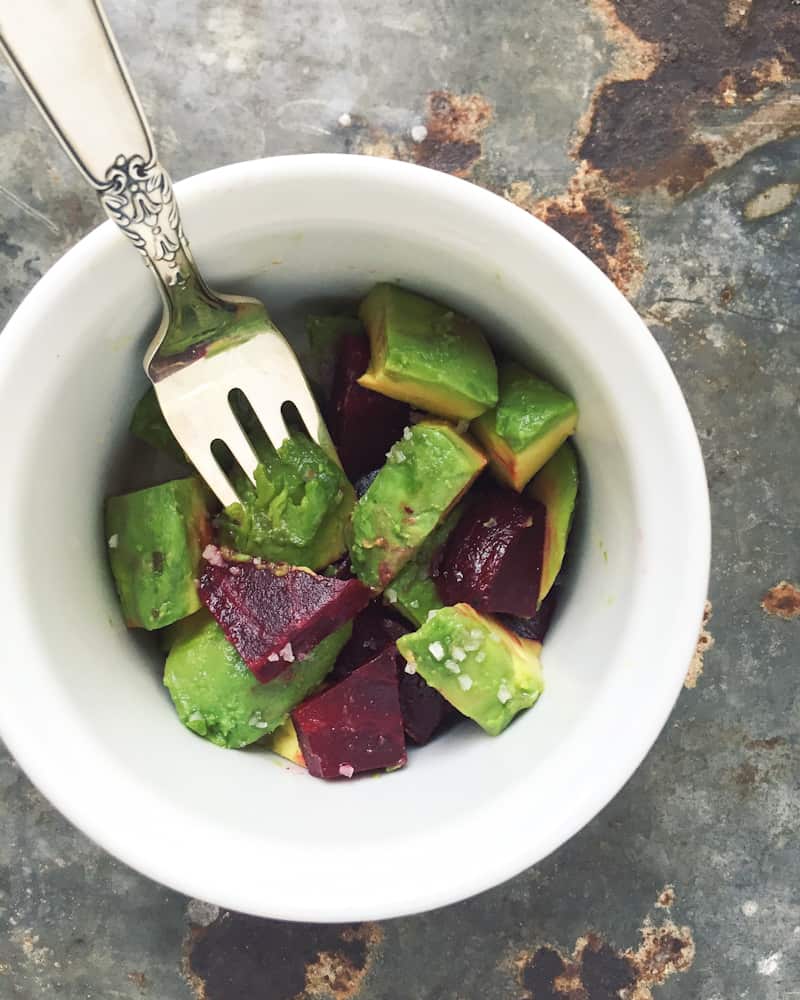 Beets with diced avocado in bowl