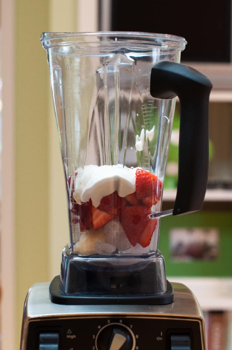Strawberries, banana, and yogurt in the vitamin before blending
