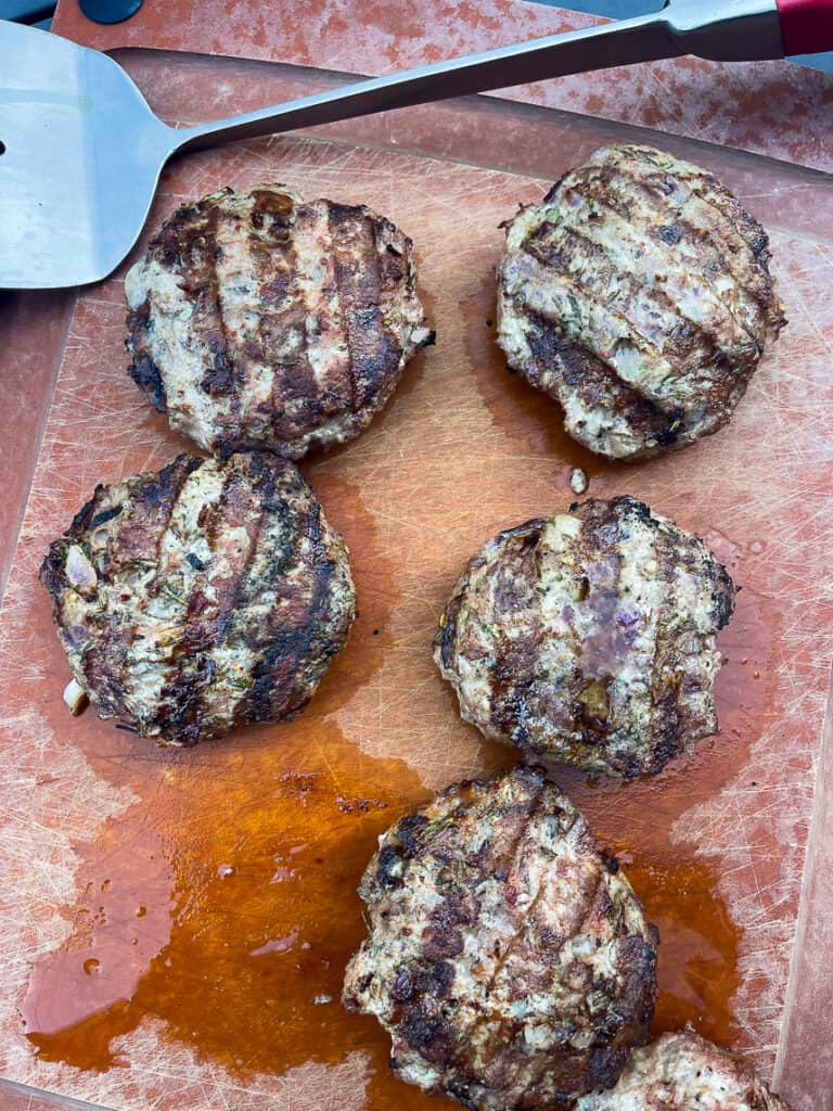 Turkey burgers with rosemary and thyme off the grill.