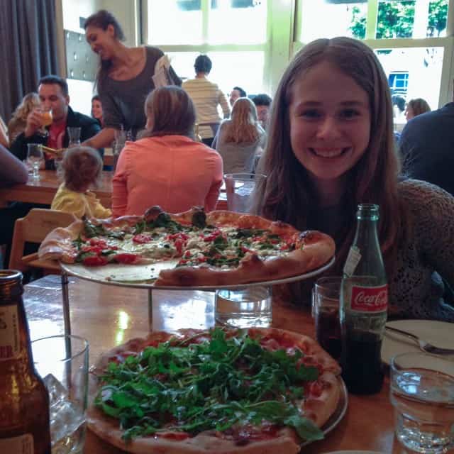 Zoe enjoying pizza