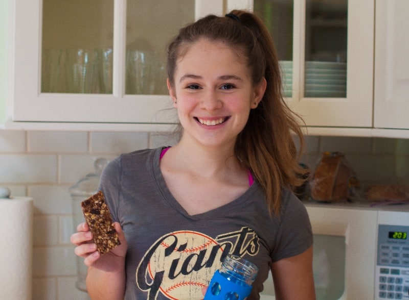 Zoe with a granola bar