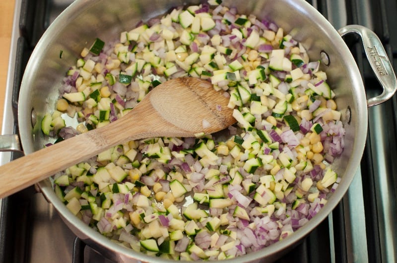 zucchini onion and corn in skillet